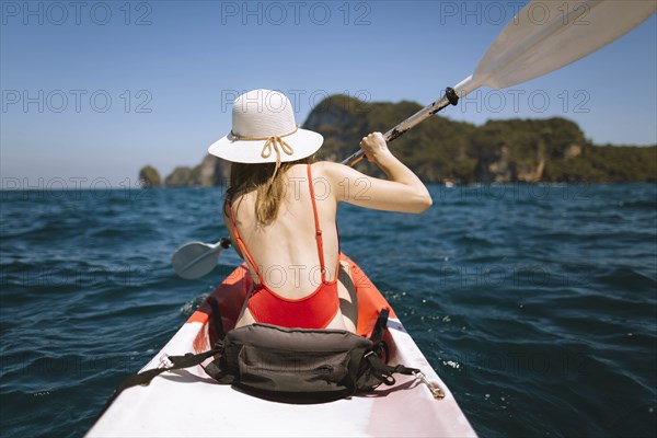 Young woman in kayak on sea in Krabi, Thailand