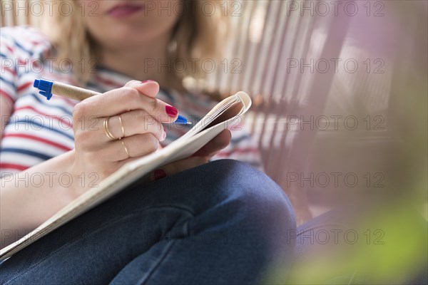 Woman writing in her diary