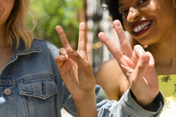 Friends doing peace signs