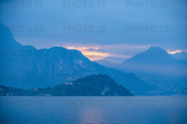 Sunset sky over mountains by Lake Como, Italy