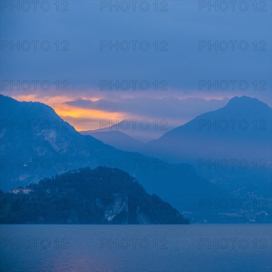 Sunset sky over mountains by Lake Como, Italy