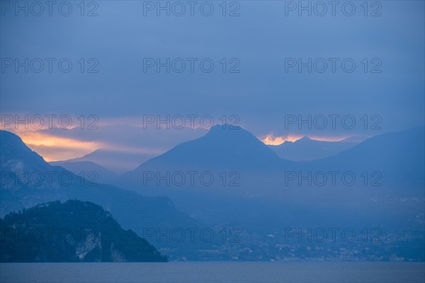 Sunset sky over mountains by Lake Como, Italy