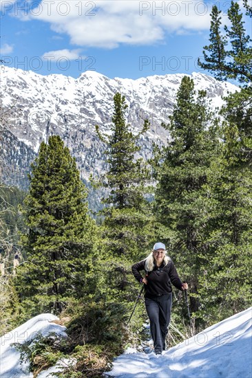 Mature woman hiking on Munkel Trail in Dolomites, Italy