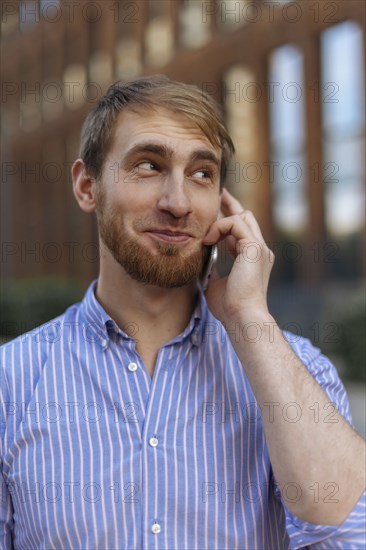 Bearded man on phone call