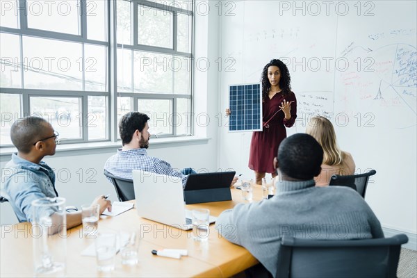 Women using diagram during office presentation