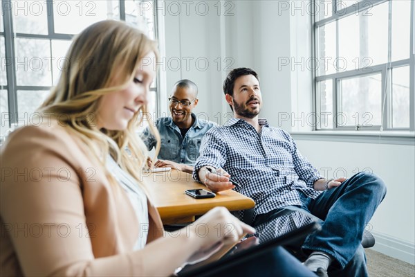 Coworkers in board room during meeting