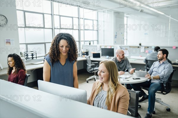 Women using computer in office