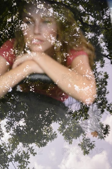 View through windscreen of young woman in car