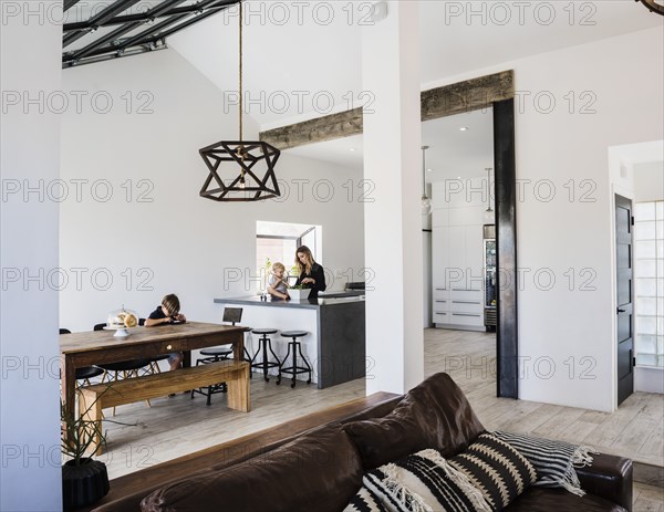 Mother and children in kitchen and dining room