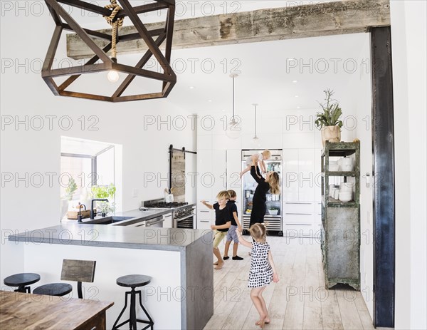 Mother and children in kitchen