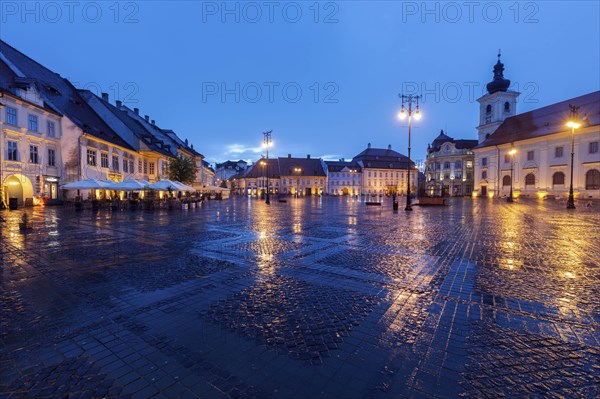 Wet Grand Square at sunset in Sibiu