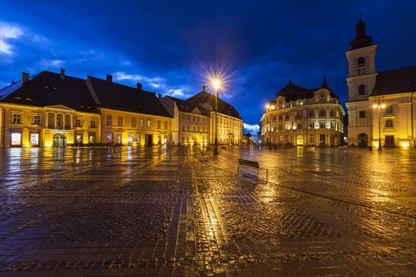 Wet Grand Square at sunset in Sibiu