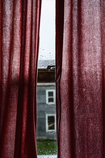 Red curtains over window