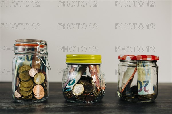 Euro currency in glass jars