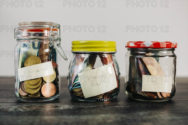 Euro currency in glass jars