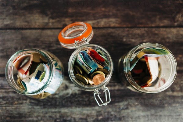 Euro currency in glass jars