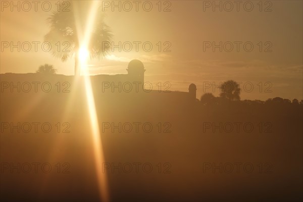 Silhouette of Castillo de San Marcos at sunset in St. Augustine