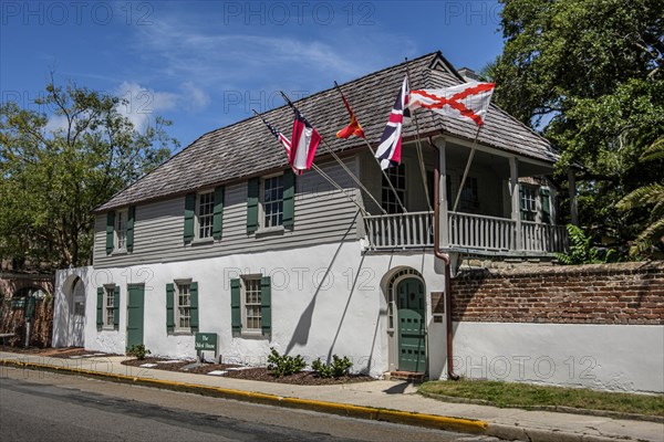 House with multiple flags in St. Augustine