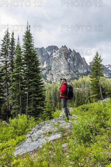 Senior man hiking by mountain in Stanley