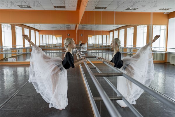 Ballet dancer practicing at barre