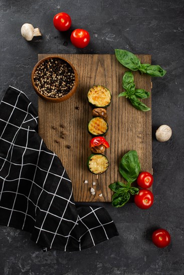 Grilled mushroom and courgette skewer on cutting board