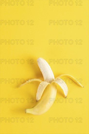 Banana on yellow surface