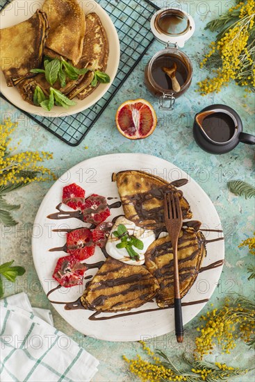 Crepes with chocolate sauce and blood oranges