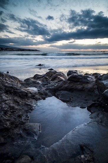 Rocks on beach at sunset in Tenerife