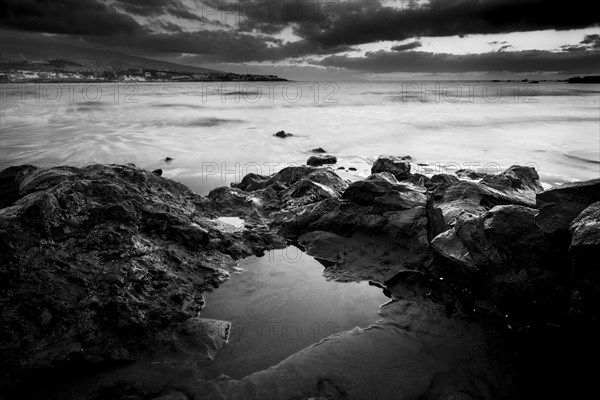 Rocks on beach at sunset in Tenerife