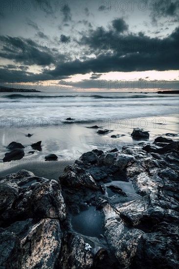 Rocks on beach at sunset in Tenerife