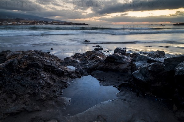 Rocks on beach at sunset in Tenerife