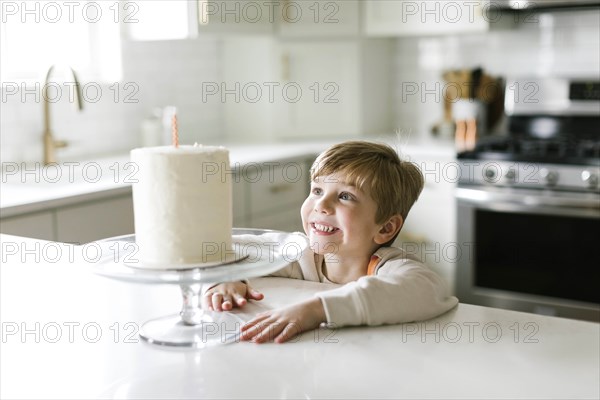 Boy smiling at birthday cake