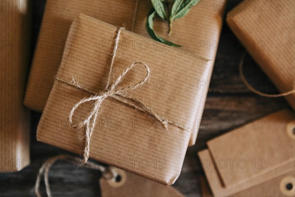 Presents wrapped in brown paper and string