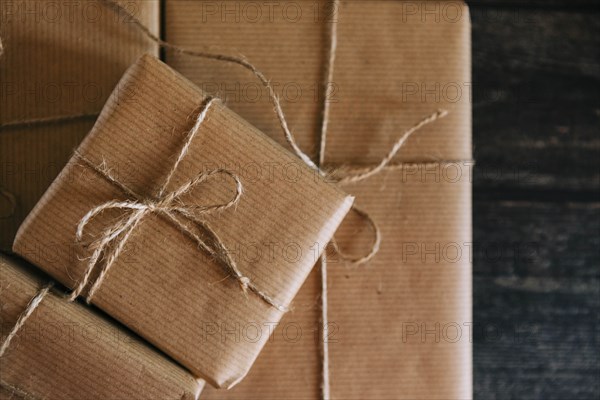 Presents wrapped in brown paper and string