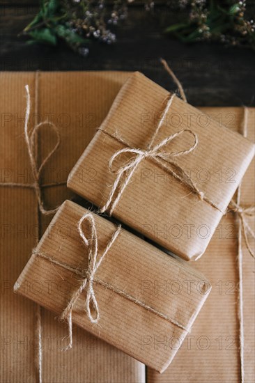 Presents wrapped in brown paper and string