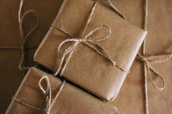 Presents wrapped in brown paper and string