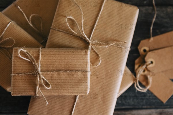 Presents wrapped in brown paper and string