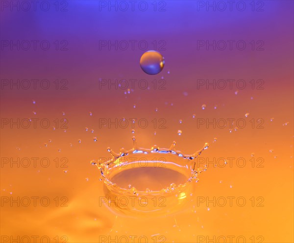 Orange and purple splashing water