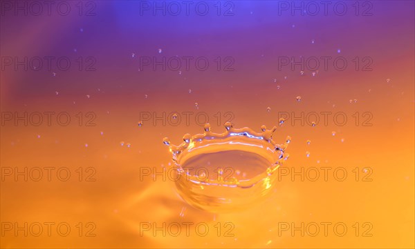 Orange and purple splashing water