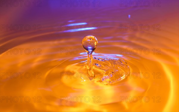 Orange and purple splashing water