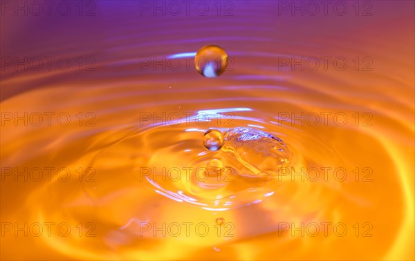 Orange and purple splashing water