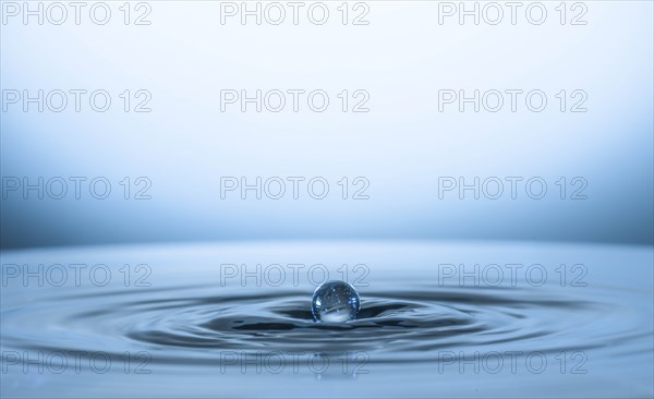 Water drop creating circular ripples