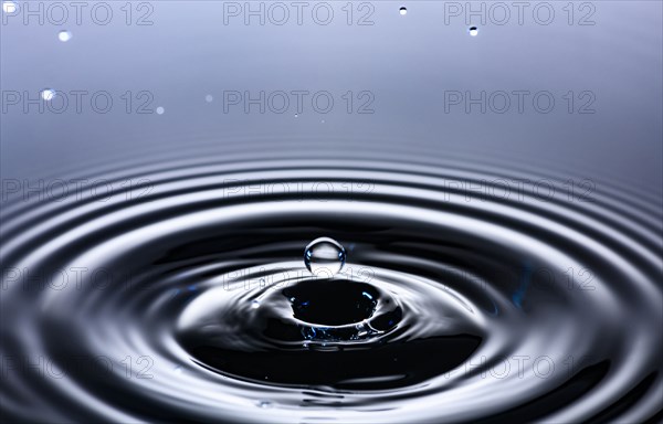 Water drop creating circular ripples