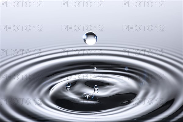 Water drop creating circular ripples