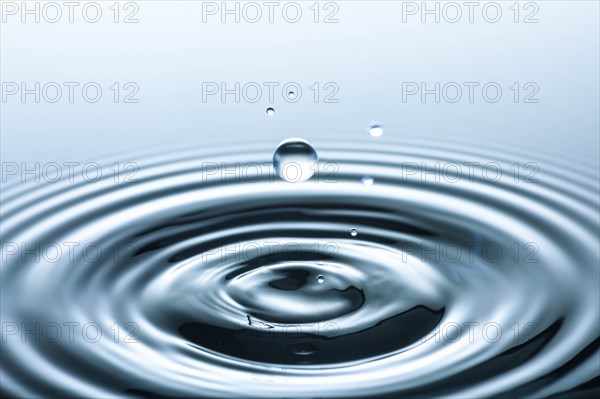 Water drop creating circular ripples