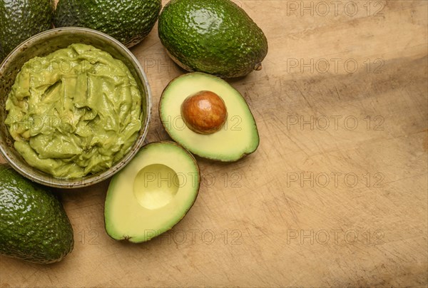 Bowl of guacamole with avocados