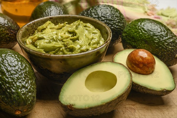 Bowl of guacamole with avocados