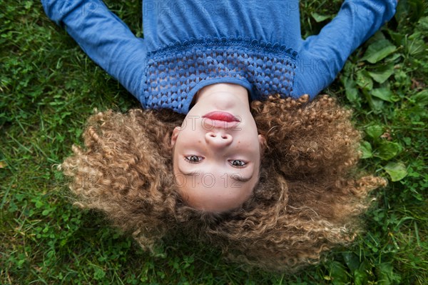 Girl lying on grass