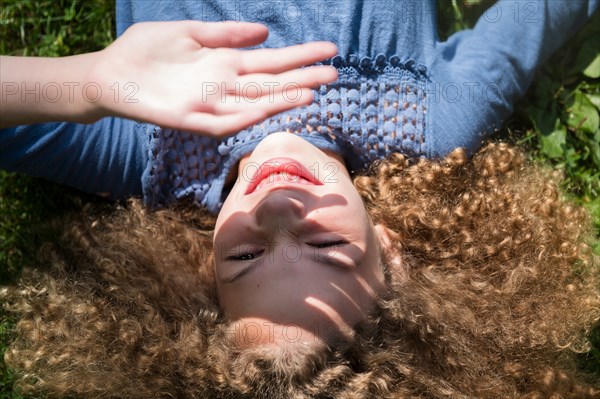 Girl shielding her eyes