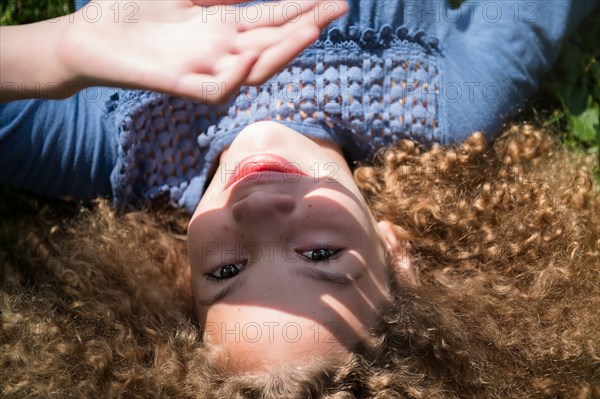 Girl shielding her eyes